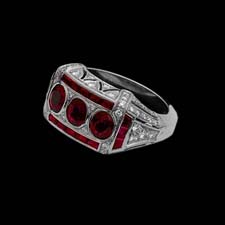 This stunning ruby and diamond ring makes a bold statement. Set in platinum, this square-cut ring shimmers with 1.45cts in three oval rubies, .60cts in bag rubies, and .50cts. in 74 diamonds.