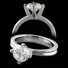 A beautiful 18k white gold solitaire engagement ring from Eddie Sakamoto. The ring features a split groove design that goes around the entire ring. This ring features a 1 carat diamond, but can hold a stone ranging from .50cw on up. The ring measures 3.55m, at the widest part of the ring, and 2.25mm at the lowest part of the ring near the prongs. Center stone is not included.