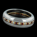 Steven Kretchmer's 18kt gold diamond and ruby center wedding band. The ring is set with .19ct of diamonds VVS E-F quality and .21ct of gem rubies.  You can engrave the inside of the ring with your special words.