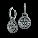 This is a wonderful pair of 18k diamond earrings from Beverley K.  The huggie hoops have pave diamonds on the front and the charms have a intricate diamond design that is surrounded by a circle border.  These earrings have a total diamond weight of .55ct.  