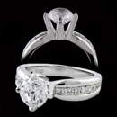 A gorgeous side stone diamond engagement ring from Eddie Sakamoto. The center stone for this ring is 1 carat, but can accommodate any size stone from .50cw on up. The shank, of the ring, measures 5.3mm and tappers to 2.8mm. The diamonds on the side go down half way through the shank. The total diamond weight on the mounting is .29ct. total weight.