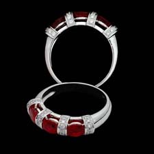This beautiful diamond and ruby ring from the Pearlman's Collection features three round red rubies (1.26ct.tw.) separated by diamond stripes (.21cts.).