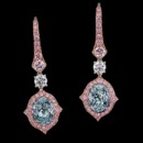 A truly one of a kind unique pair of 2.01 Fancy Light Greenish Blue, VS1 diamond earrings. These, exquisite, earrings are a work of art that are like none other on any store you will see.
