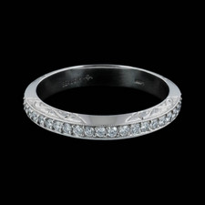 Beaudry's Platinum Boutique Beveled eternity wedding band is set with .40-.45ctw of fine round diamonds. Please call for current pricing information.