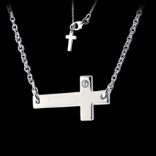 A beautiful sideways cross necklace with a I1, G-I color, 1.3mm, 1/10ct diamond. This necklace can be adjusted to be worn at 18 inches or 16 inches. The cross itself measures at 15mm X 8.3mm.  