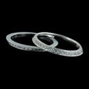 These are a set of 18kt white gold diamond guard wedding rings.  There is a slight angle to the rings to accent the center ring.  These are priced per each half.  Approximately .34ct tw. each and are 2.0mm each.