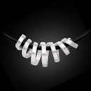 A unique sterling silver Bastian Inverun swirl spiral design necklace with a matted finish. Think fun, contemporary design is scratch resistant. Measures approximately: Length: 46.30 mm X Width: 19.66 mm at the highest point and 12.66 mm at the lowest point. Includes 17.7"; 3mm rubber chain with bajonette clasp polished.  This is a must have piece.  