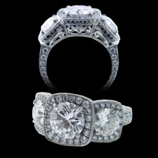 A stunning custom piece. Three stone setting each with its own halo. 