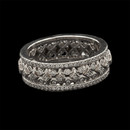 A beautiful Michael B full eternity ring from the ''Petite Quintessa'' collection.  The ring is set with 184 diamonds weighing total .70ct. The diamonds are VVS E-F ideal cuts. The band measures 6.5mm in width.  18kt white gold.  Made in America.