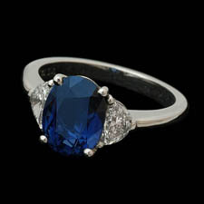 Stunning blue sapphire and diamond 3 stone ring. This ring is set with a 2.97ct sapphire and .52ct of side diamonds.